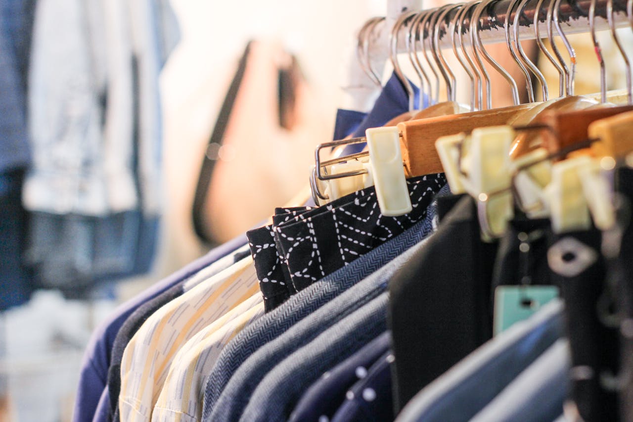 Home A vibrant assortment of clothing hanging on racks in a trendy fashion boutique.